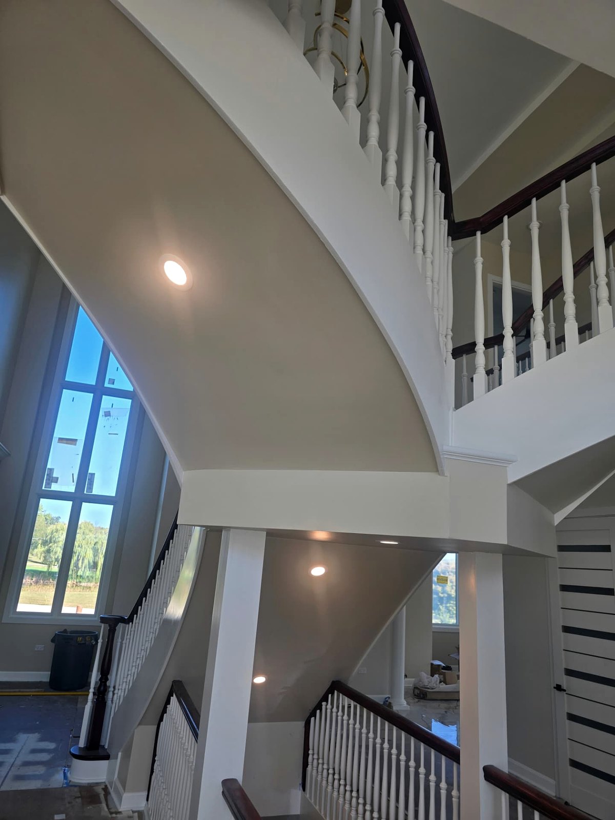 Two-storey atrium stair with recessed soffit lighting